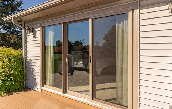 HomeGeneral's patio door installation featuring a modern sliding door with a minimalist frame, enhancing the view of the serene outdoor setting in Nebraska