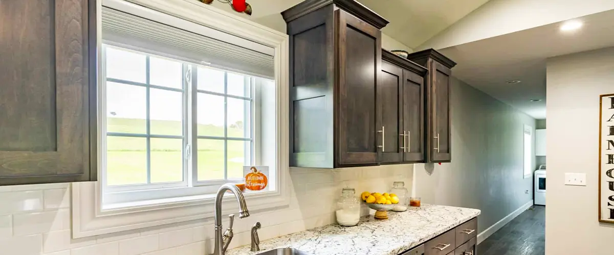 Bright kitchen with a stylish window over the sink, providing natural light and ventilation.