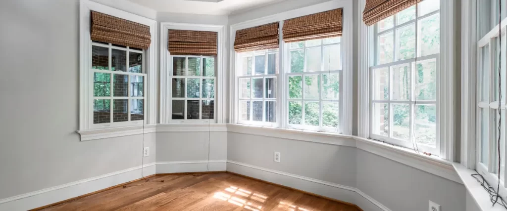 Classic bay window nook with natural light and woven blinds