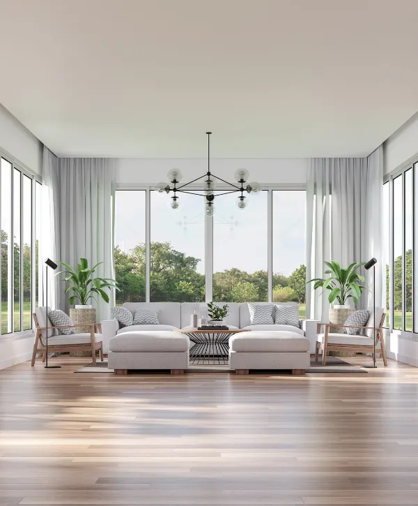 Modern living room with floor-to-ceiling glass walls, neutral furniture, and natural light.