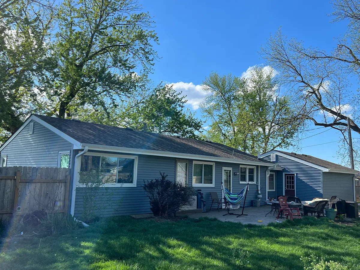 After photo of a home with new siding, showing a renovated exterior with a fresh, modern look in a suburban setting from HomeGeneral in Nebraska