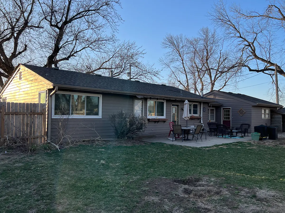 Before photo of the same home, displaying the old siding before renovation, highlighting the need for updates from HomeGeneral in Nebraska